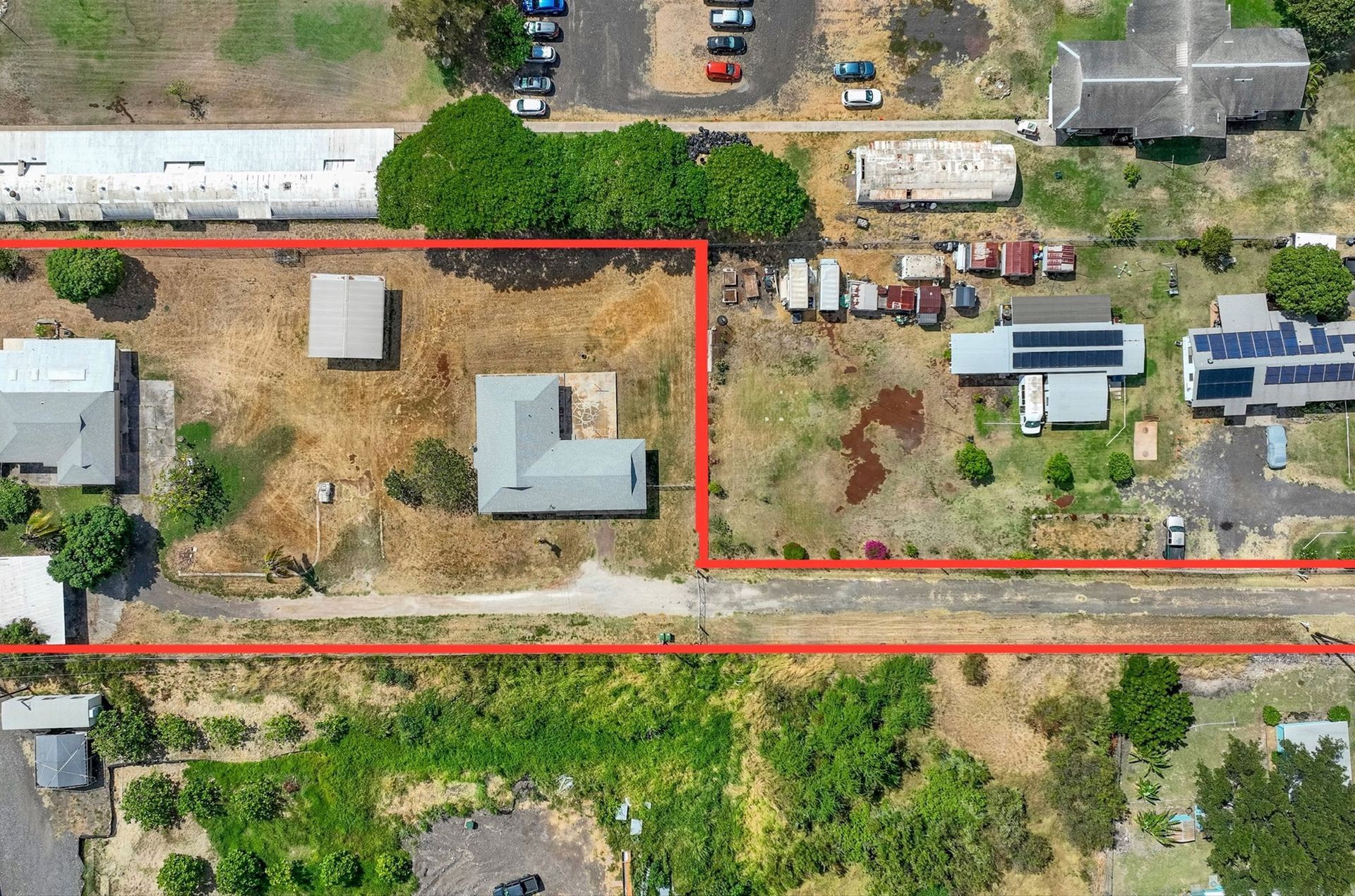 An aerial view of a residential area with a red line.