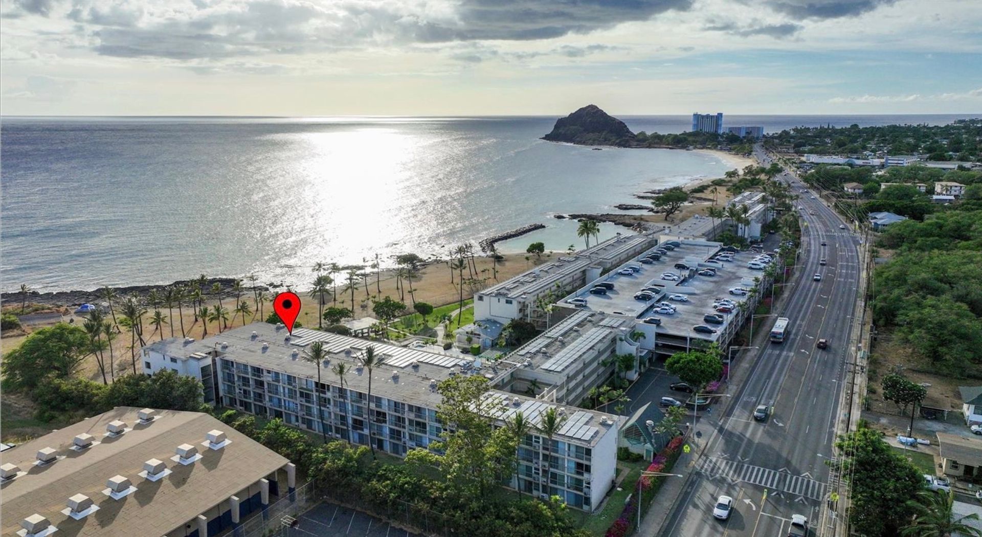 An aerial view of a city next to the ocean.
