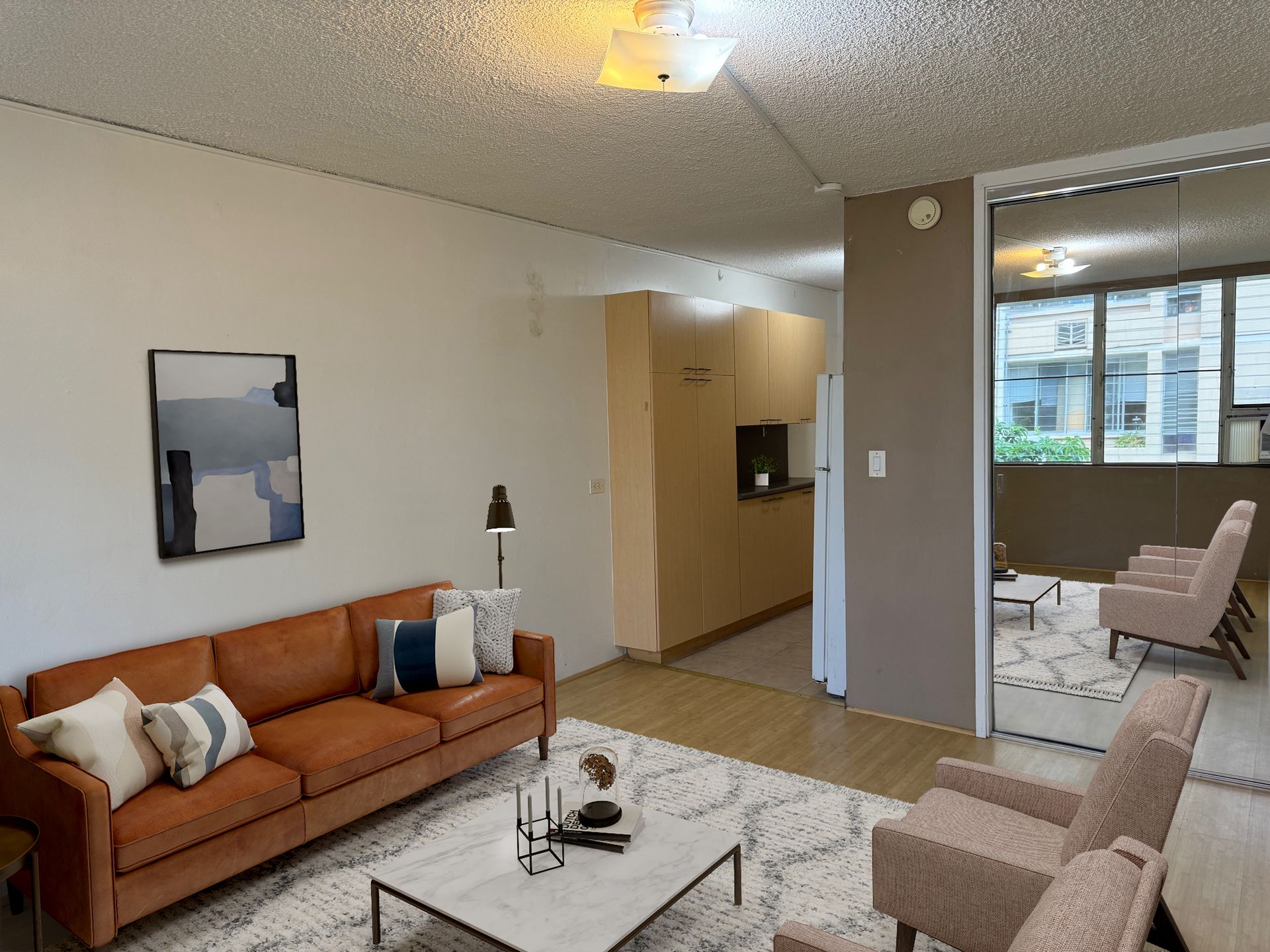 A living room with a brown couch and a white coffee table