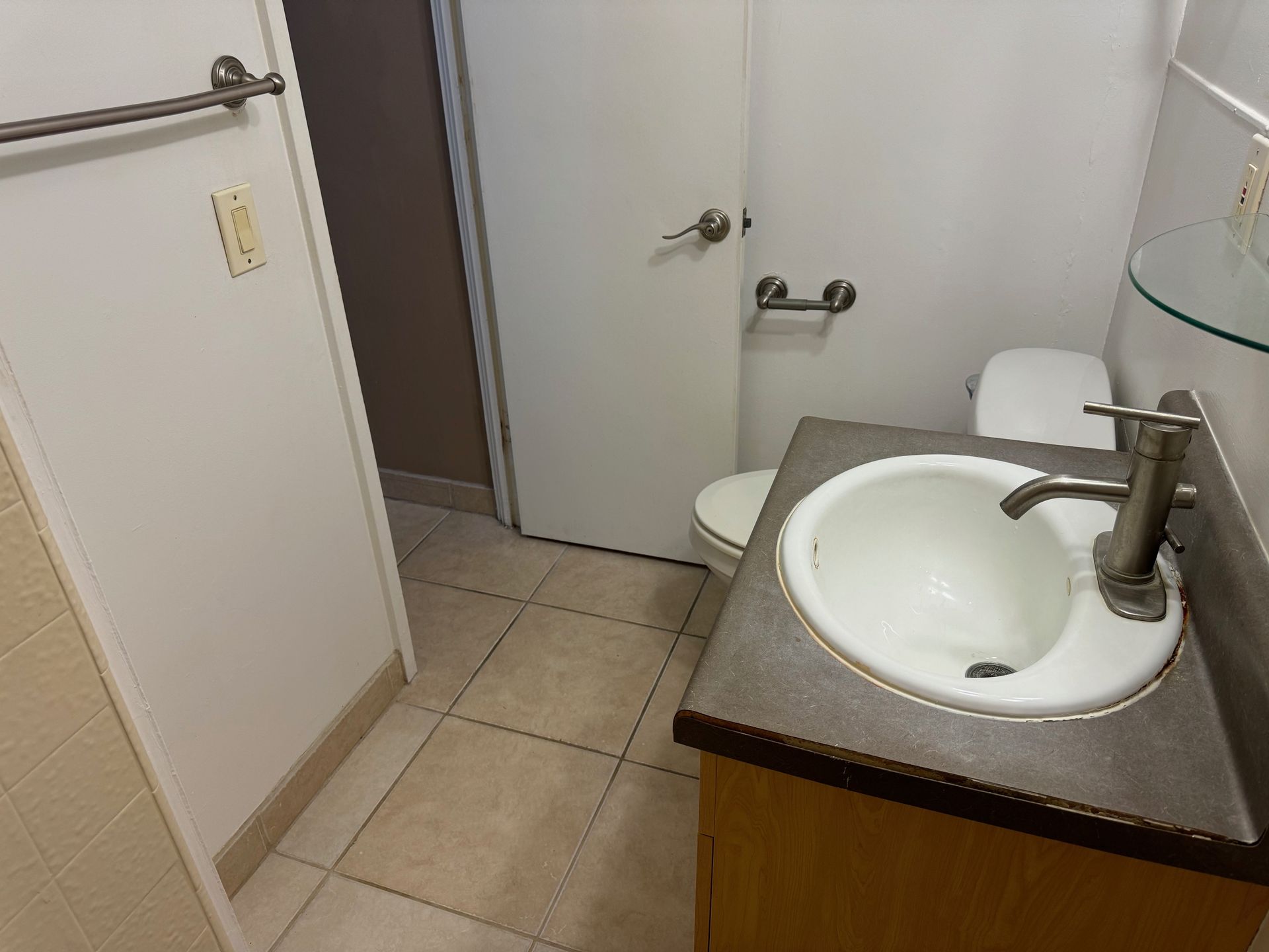 A bathroom with a sink and toilet in it