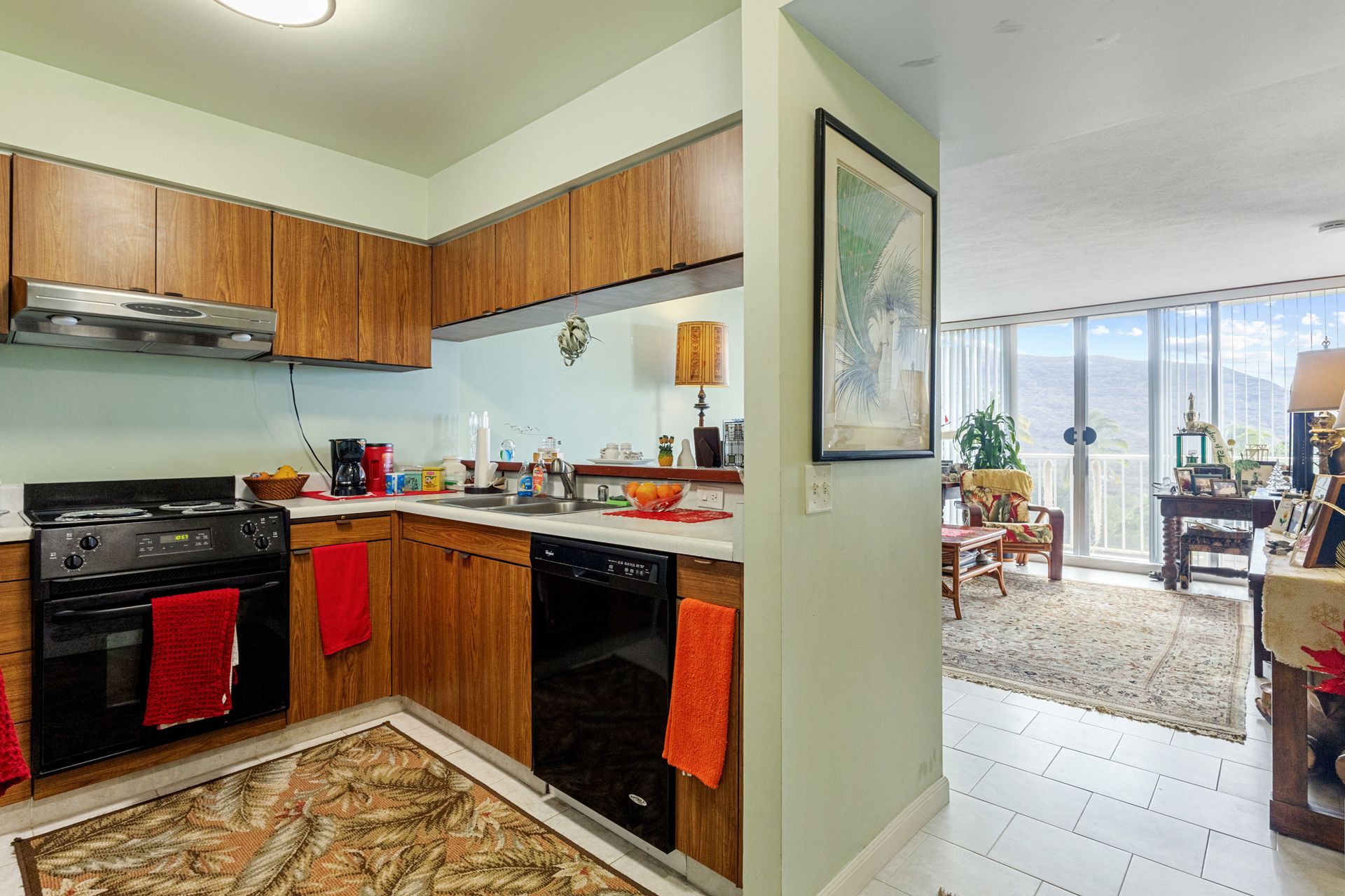 A kitchen with wooden cabinets and a black stove top oven