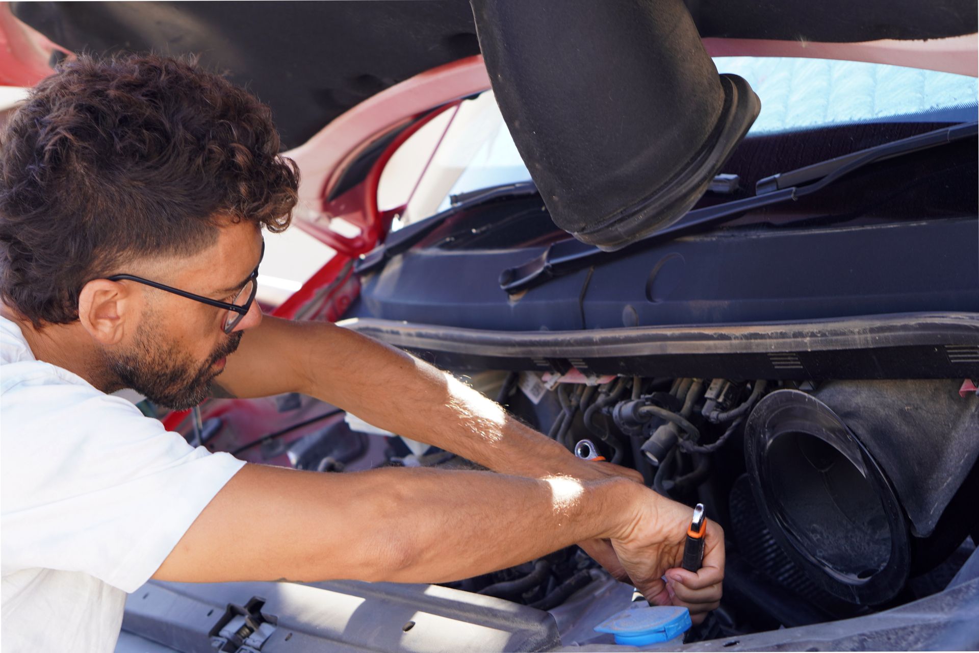 Man repairing his camper van. Man repairing his camper van.