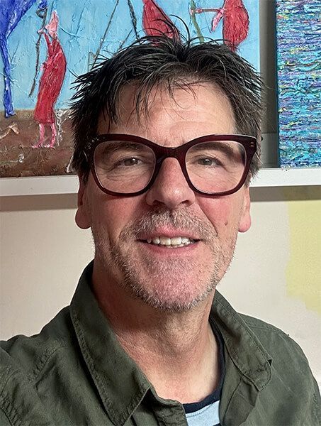 Headshot of the artist in his studio.