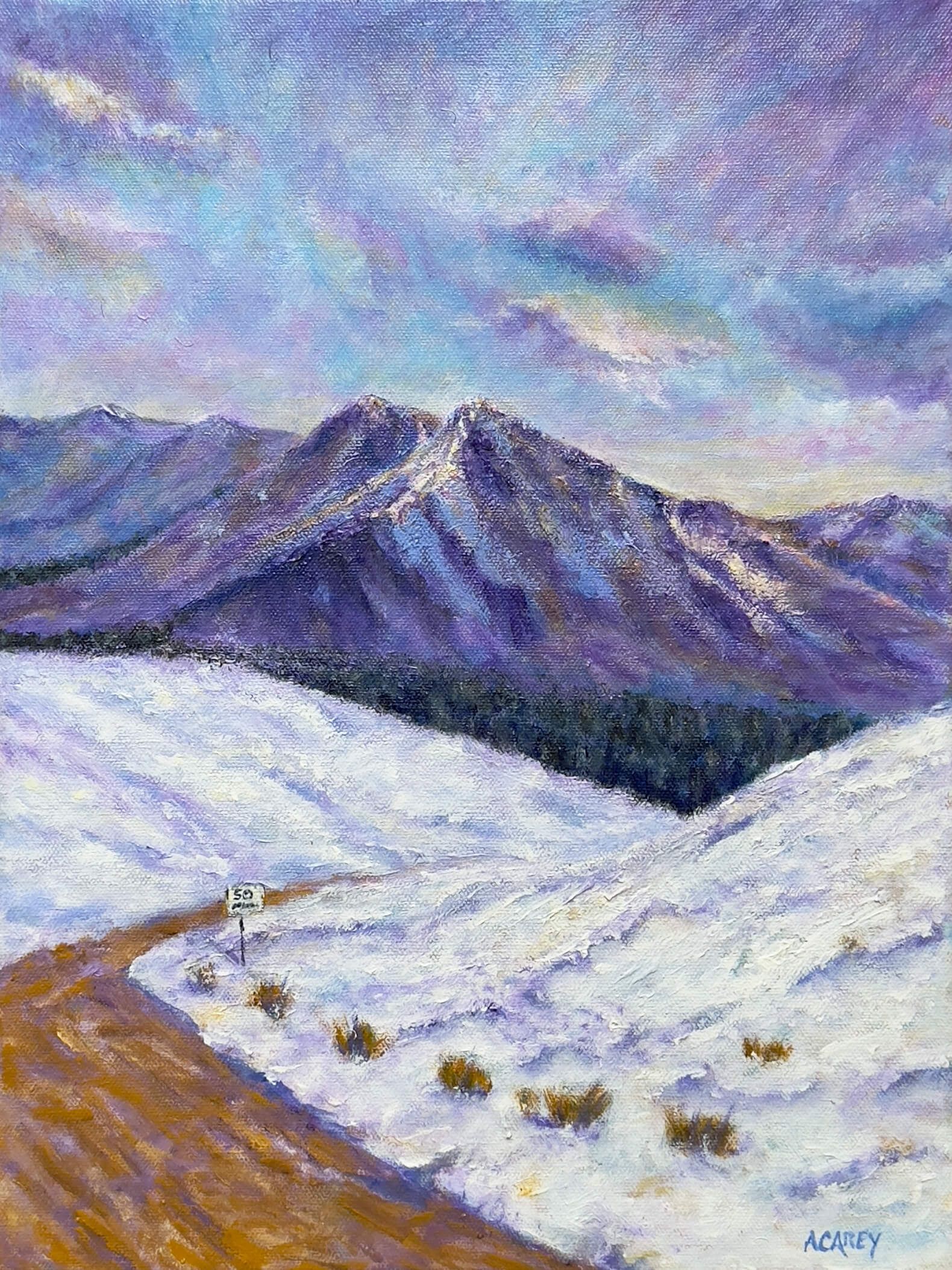 Acrylic painting of a winter mountain landscape with expansive snowfields, a winding road in the foreground, and a small roadside speed sign marked “50.” Dark evergreen trees line the base of purple and blue mountain ridges beneath a pale winter sky.