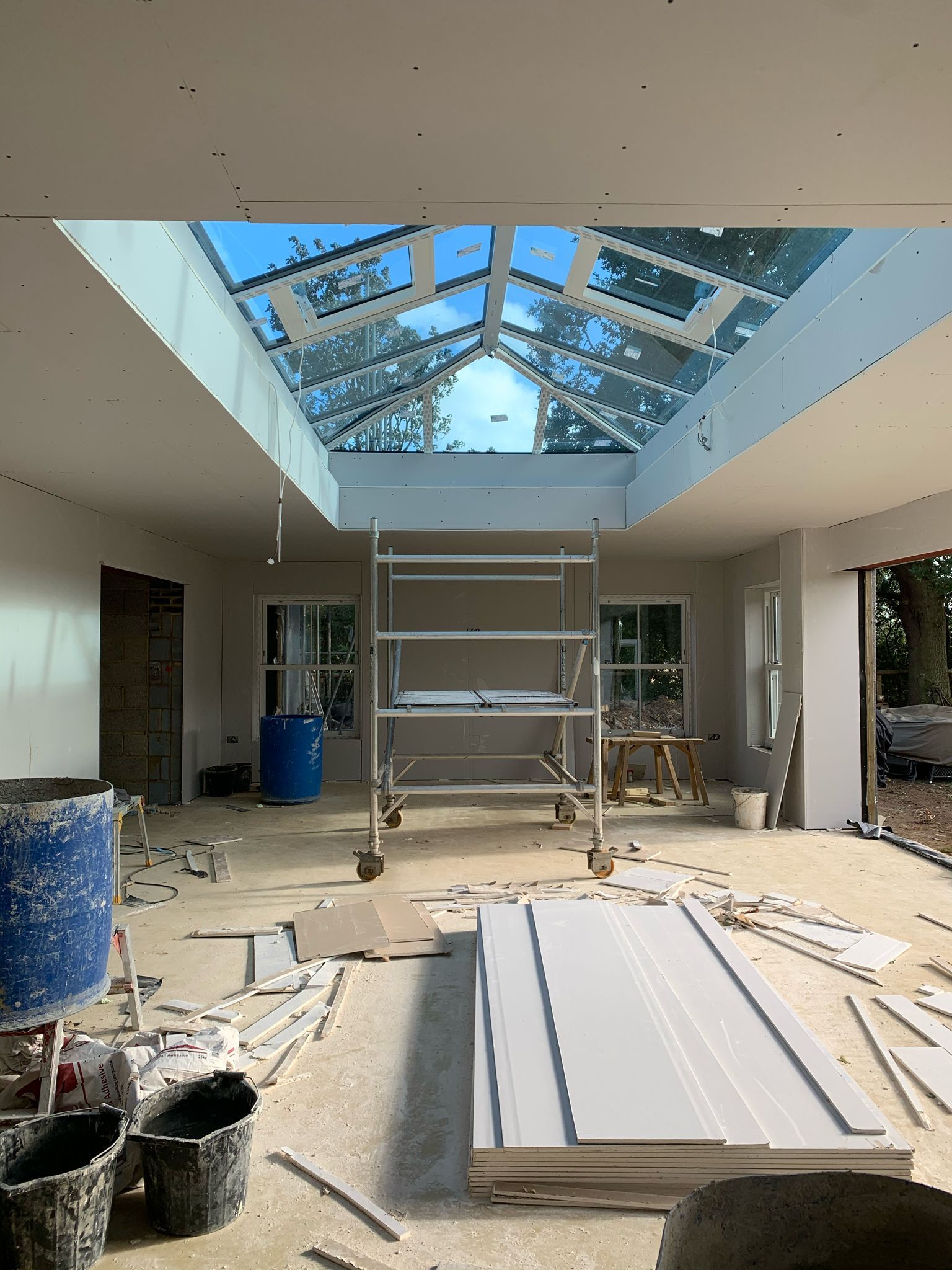 a large room with a skylight and a scaffolding in the middle of it .