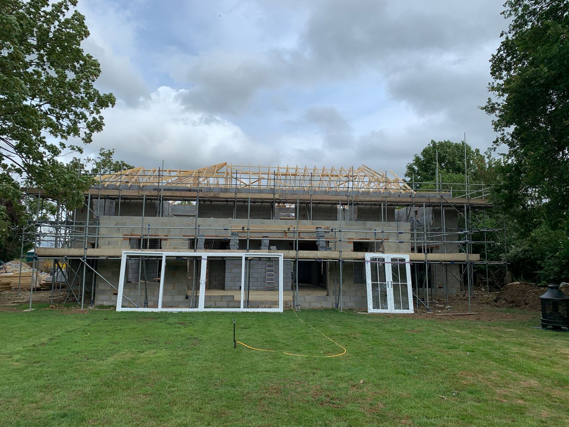 a large house is being built with scaffolding and windows .