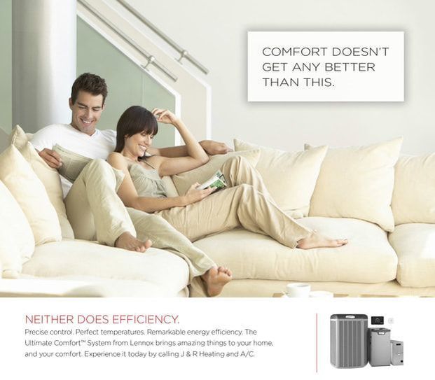 Couple relaxing on a white sofa in a modern living room, advertising an energy-efficient home comfort system.