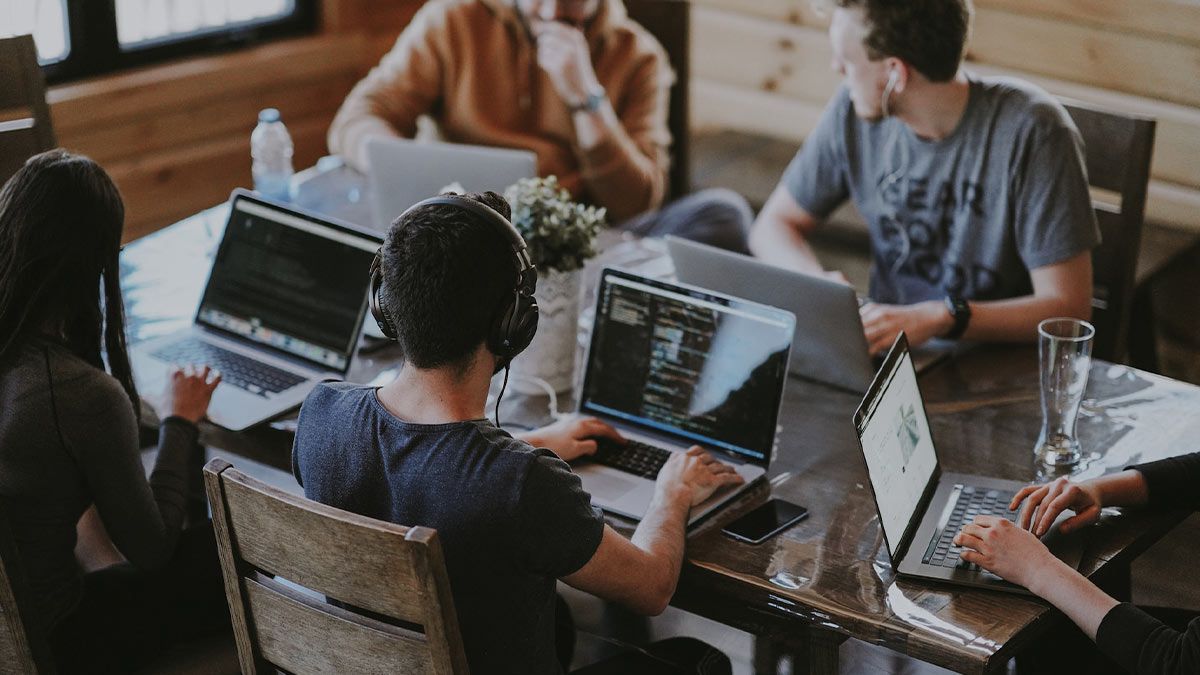 Group of people using laptop computer