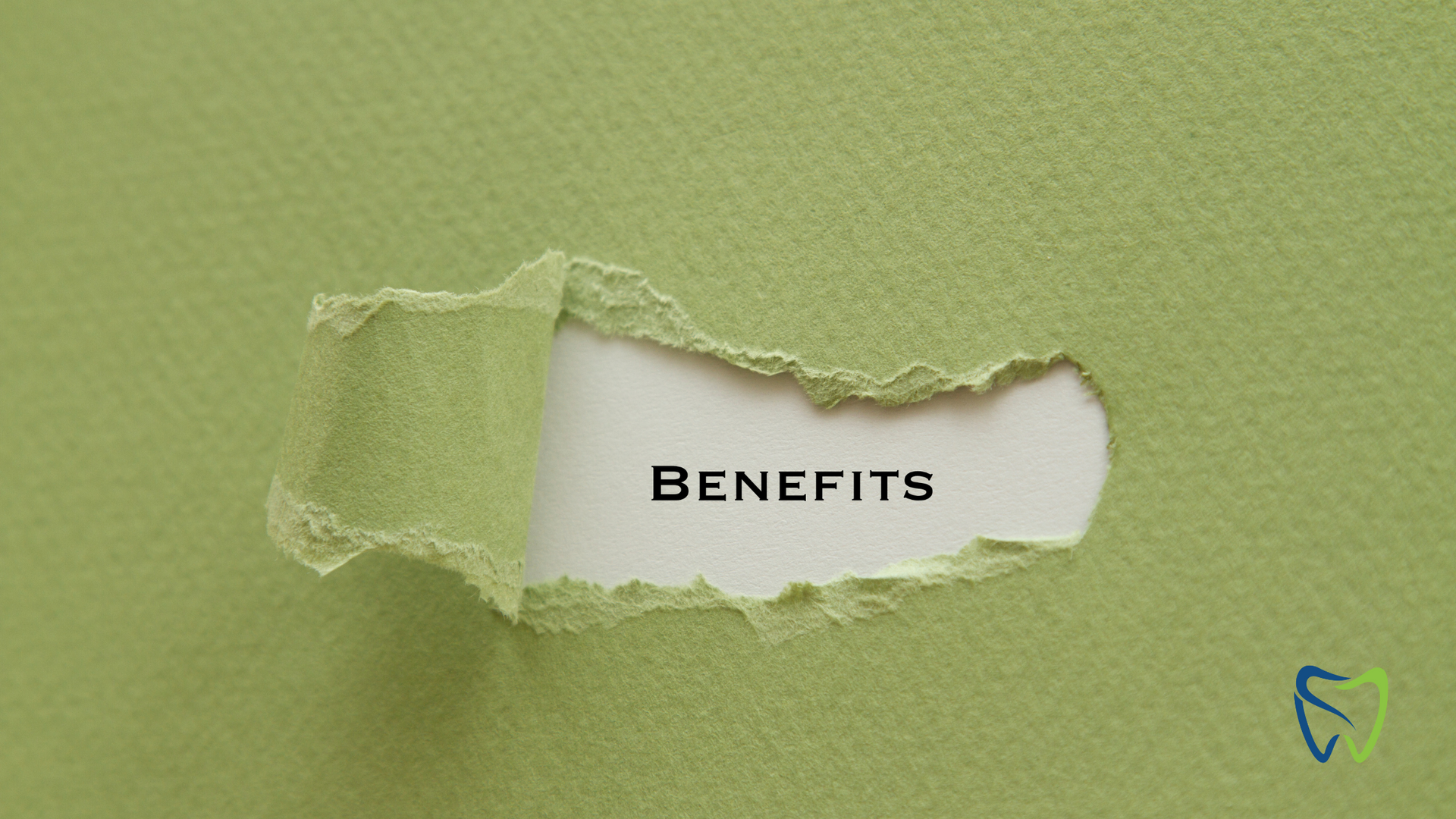 Green paper with a torn hole revealing the word
