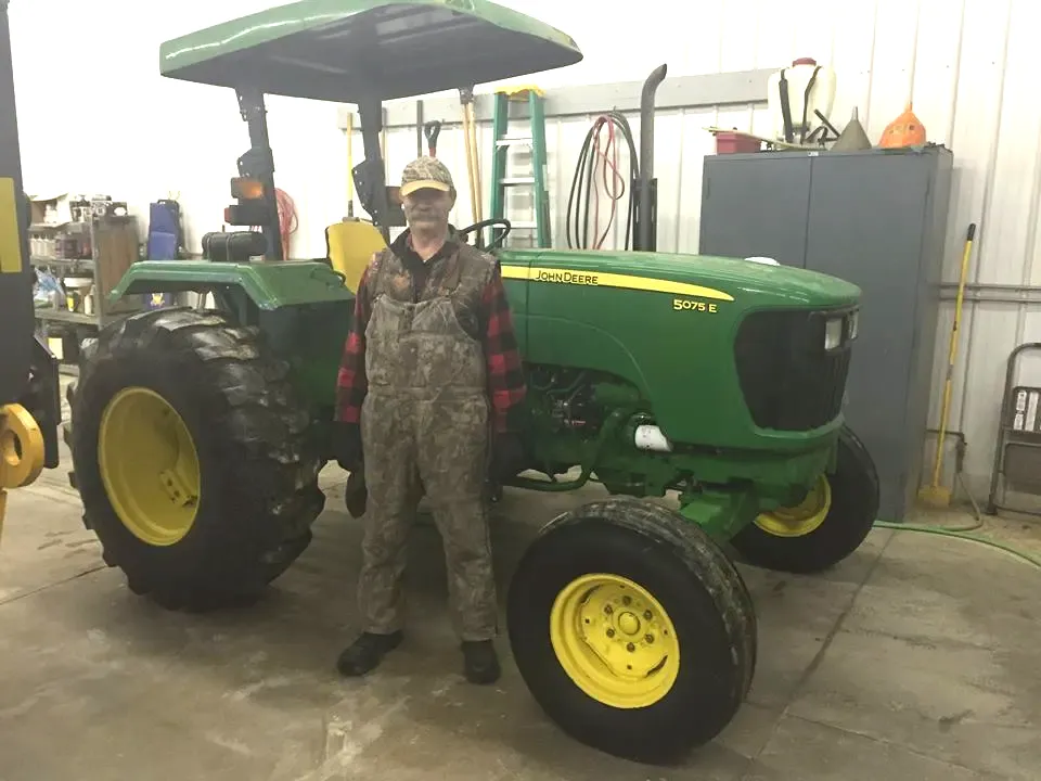 Client With Tractor | Viroqua, WI | Bruce Hill, LLC