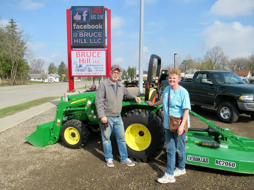 Client With Small Green Tractor | Viroqua, WI | Bruce Hill, LLC