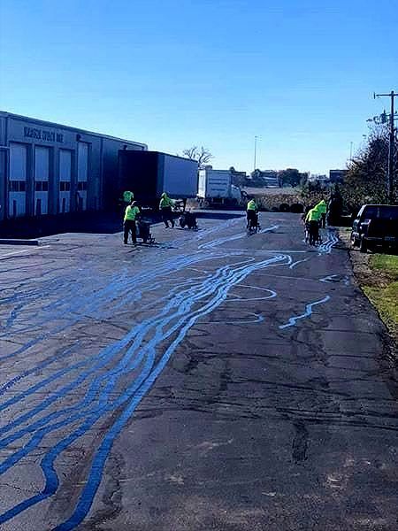 image of allseal team crack filling a parking lot