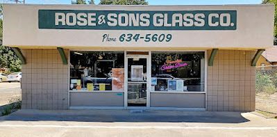 The front of a glass store called rose & sons glass co.