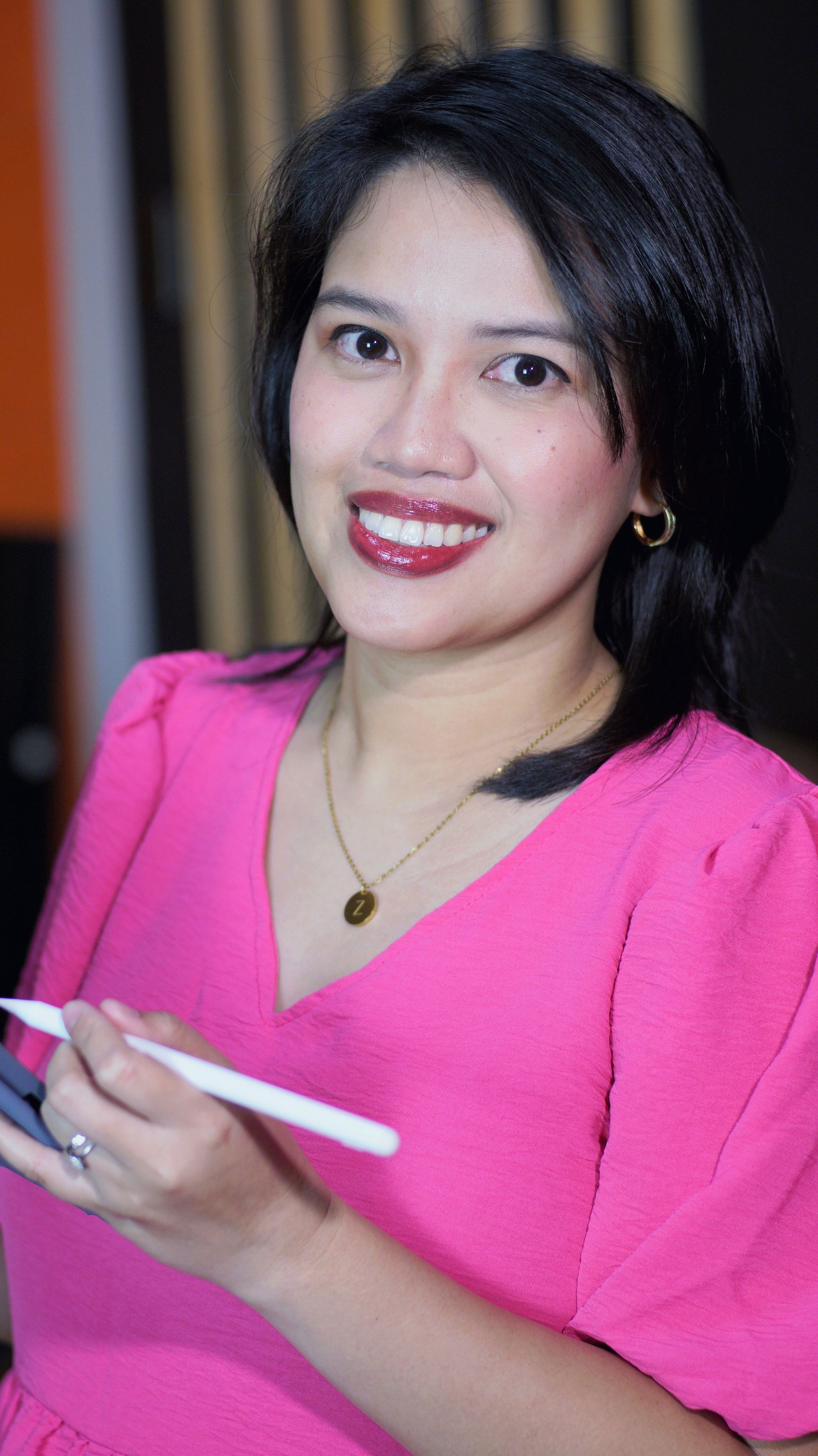 a black and white photo of a woman wearing glasses .