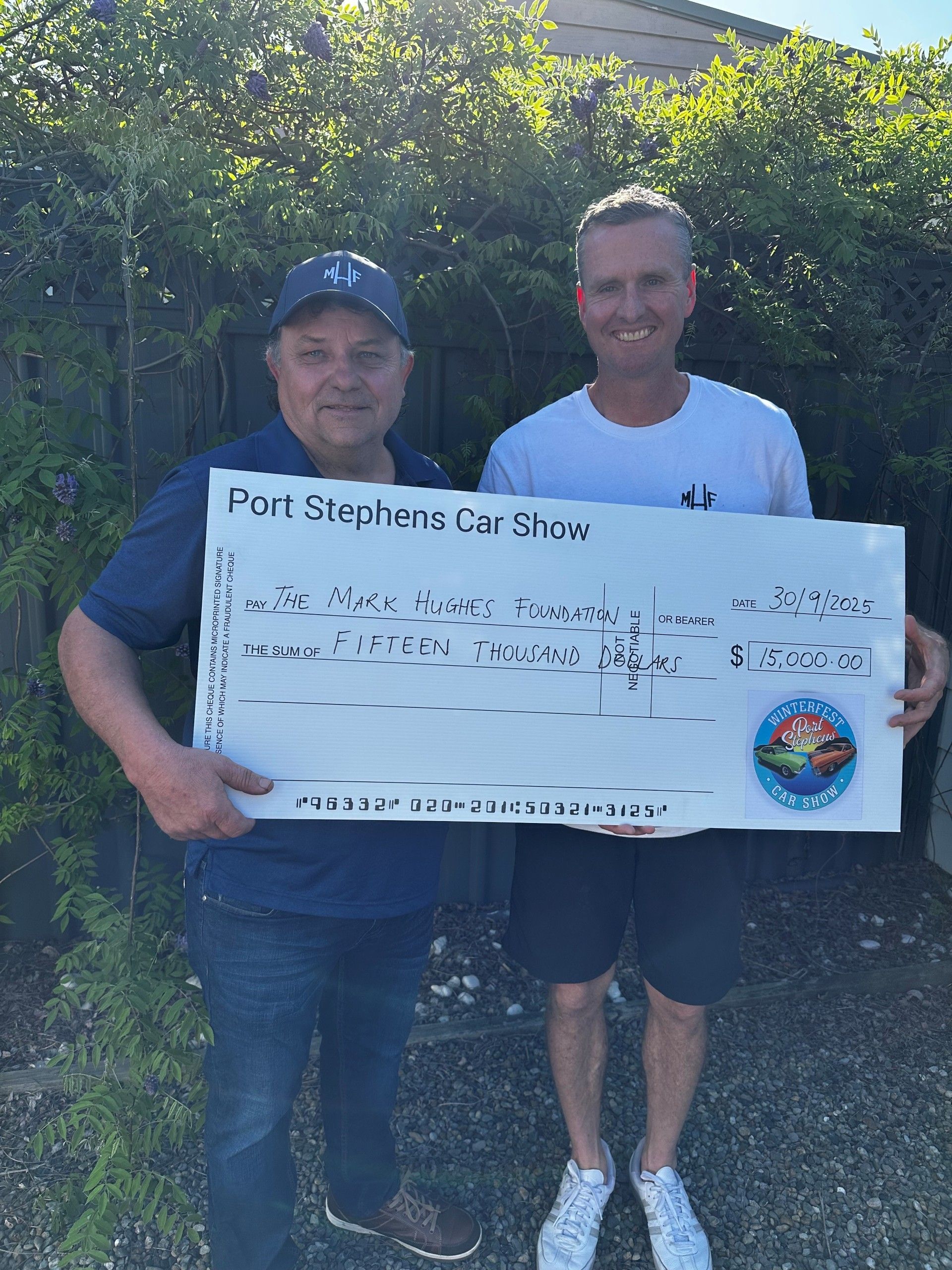 Paul presenting Mark Hughes with a donation cheque from the Port Stephens Car Show