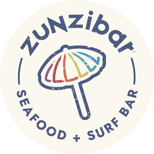 A rainbow colored umbrella is sitting on top of a stick on a white background.