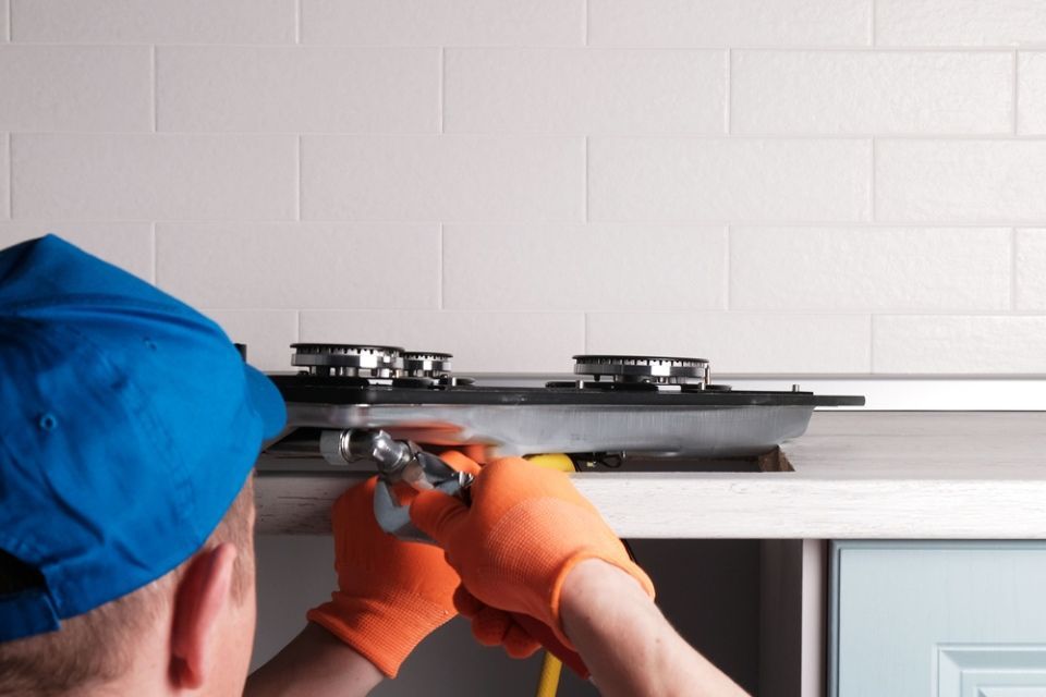 Technician is repairing gas