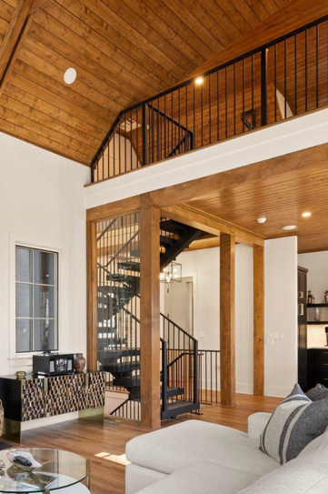 A living room with a spiral staircase and a couch
