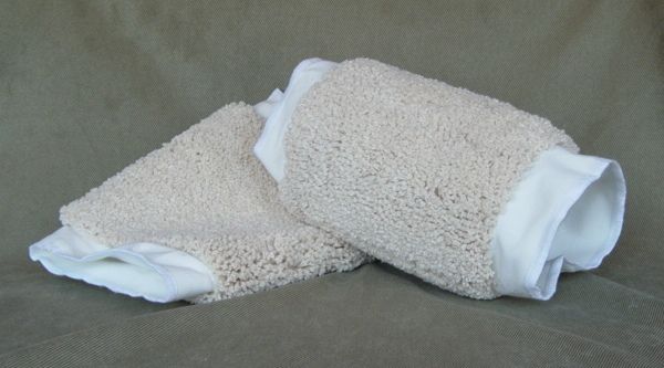 Two beige loofah-like gloves with white interior lining. One glove is open, the other is closed.