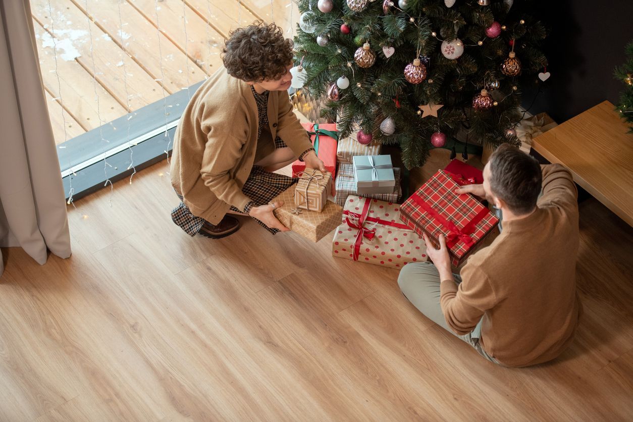 couple on hardwood floor during holidays
