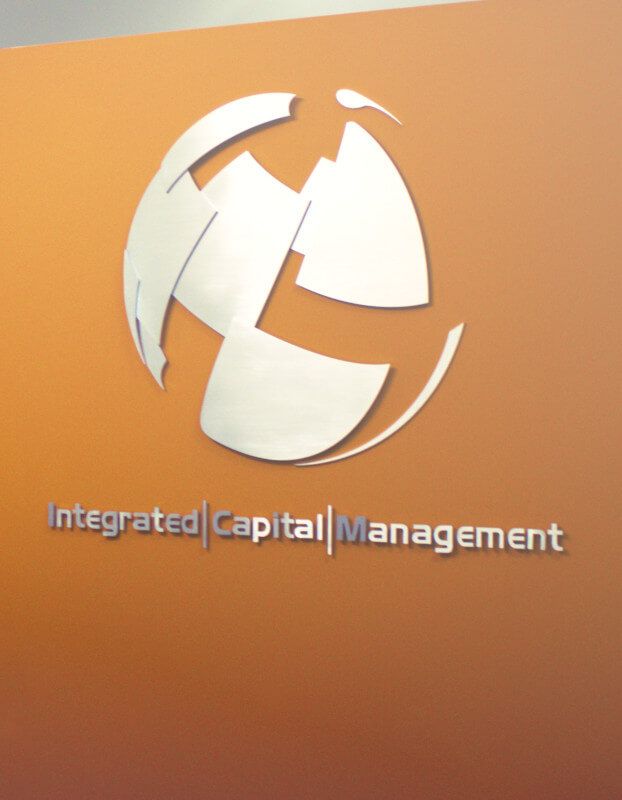 Integrated capital management logo on an orange wall