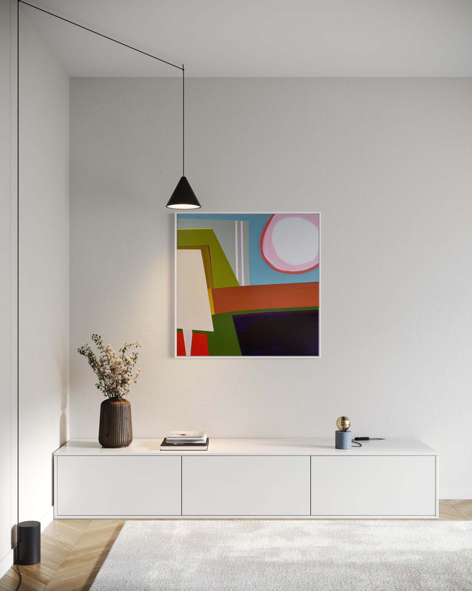 A living room with a couch , coffee table , and painting on the wall.