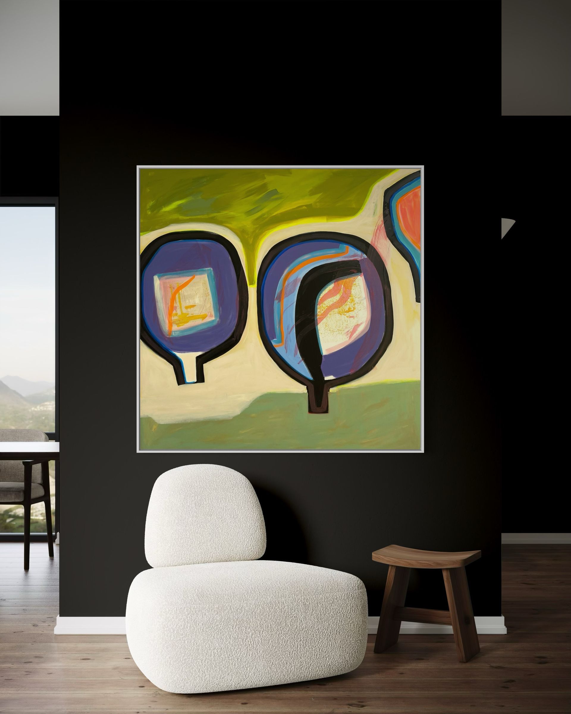 A room with a chair and a painting on the wall