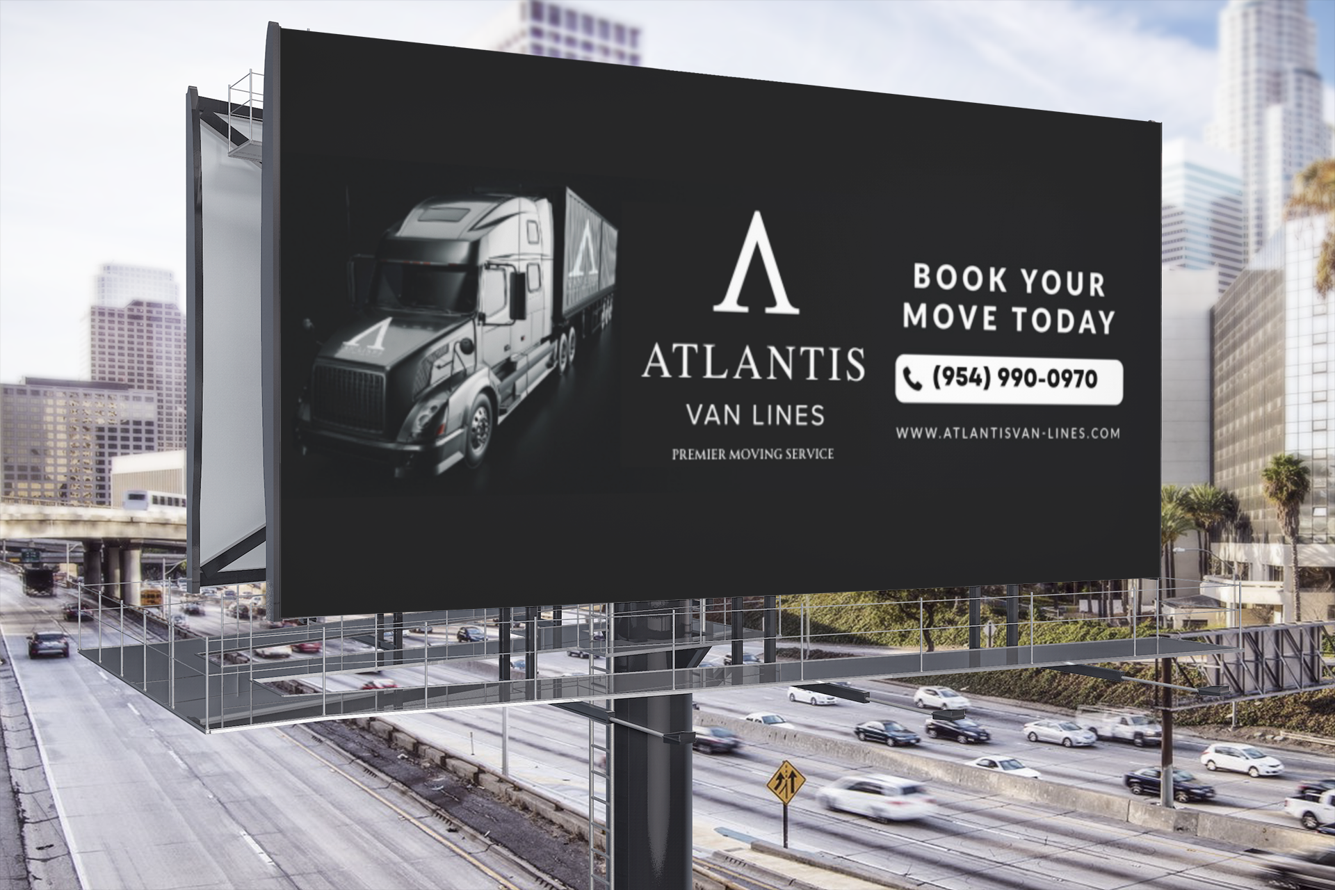 a billboard for atlantis van lines is sitting on top of a highway .