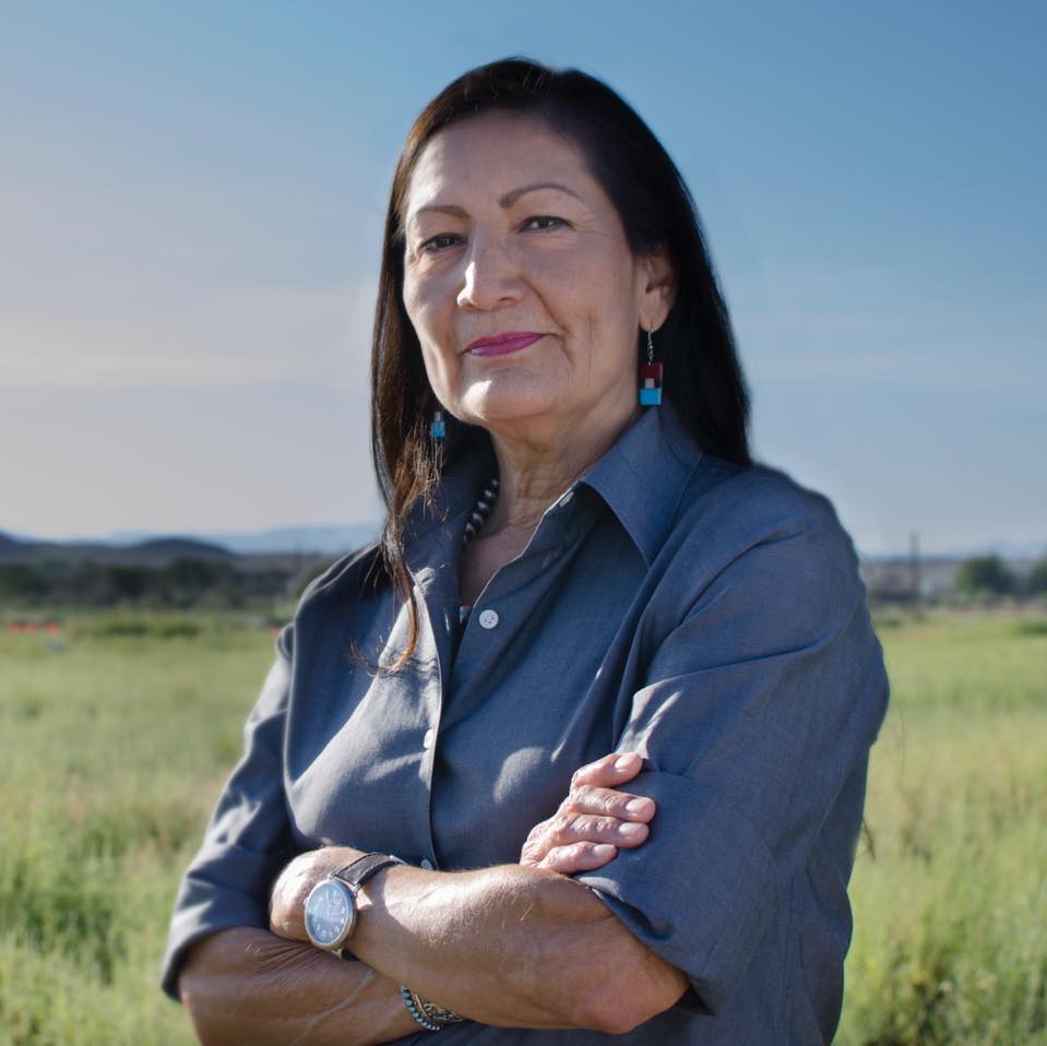 A woman with her arms crossed wearing a watch