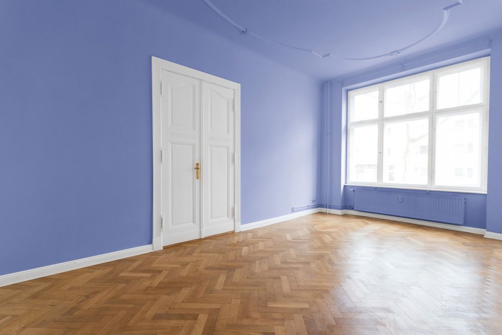 Empty Room With Wooden Floor And Window — High-Quality Building Supplies in Tamworth, NSW