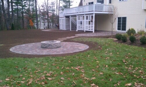 Back yard fire pit side angle in North Attleboro, MA