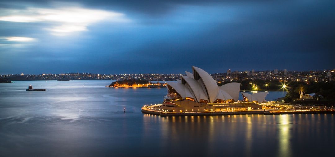 An aerial view of the opera house in sydney at night.