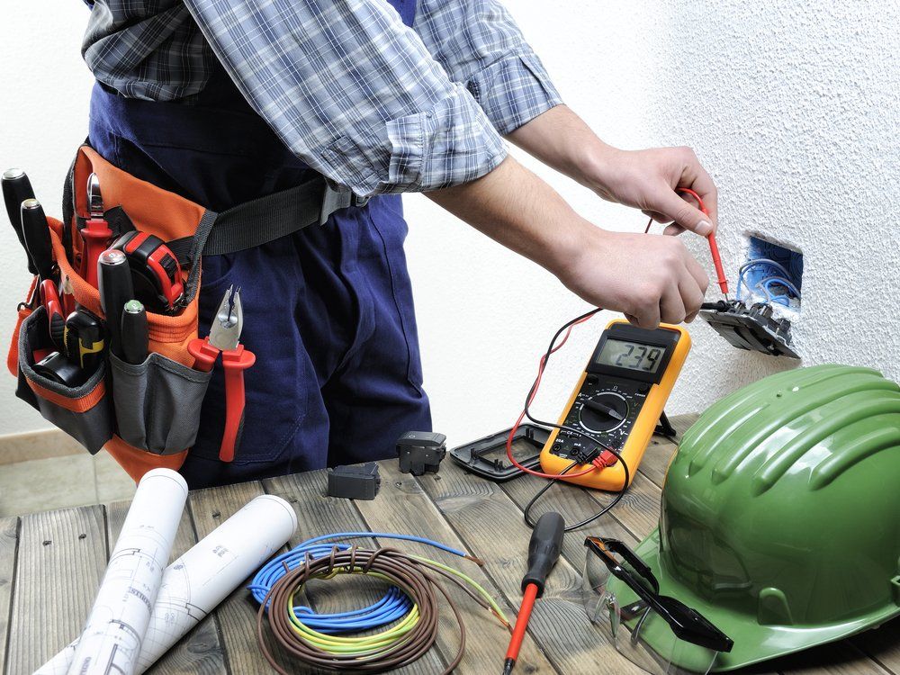 Electrician Using Tester — Electrical In Forester, NSW