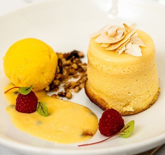 A Bowl of Soup With a Spoon on a Wooden Cutting Board — Lakeview Luxury Retreat in Canobolas, NSW