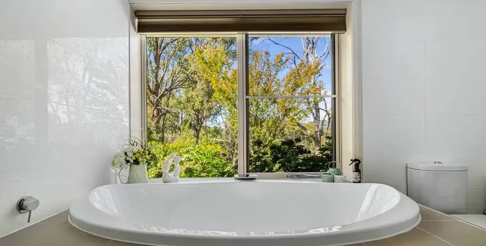Oval Bathtub in Bathroom — Lakeview Luxury Retreat in Canobolas, NSW
