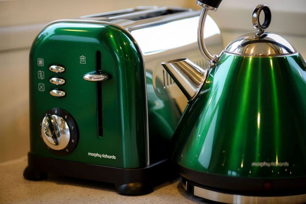 A Green Toaster and a Green Tea Kettle Are on a Counter — Lakeview Luxury Retreat in Canobolas, NSW