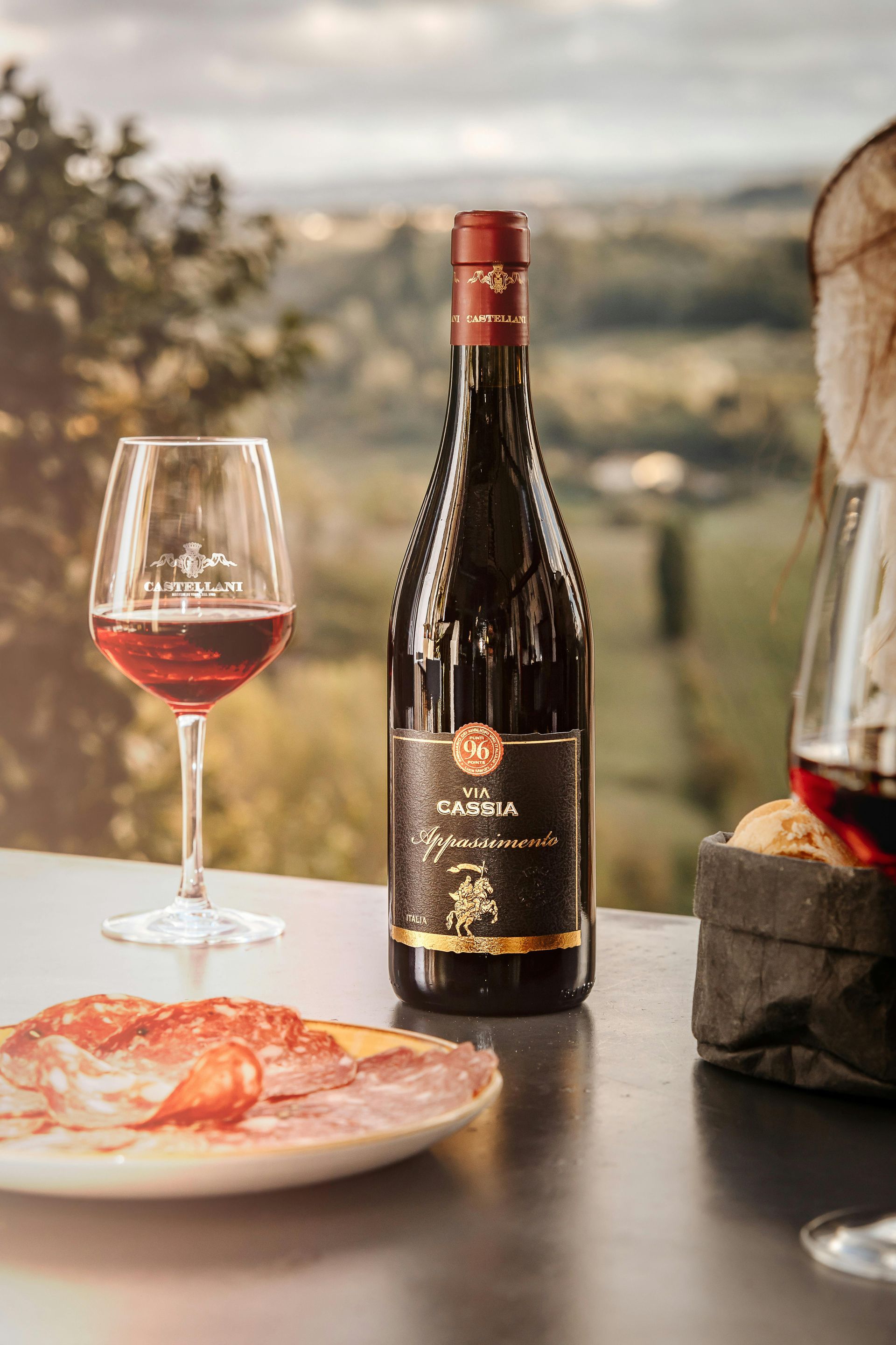 A Bottle of Wine and Two Glasses of Wine Are on a Glass Table — Lakeview Luxury Retreat in Canobolas, NSW