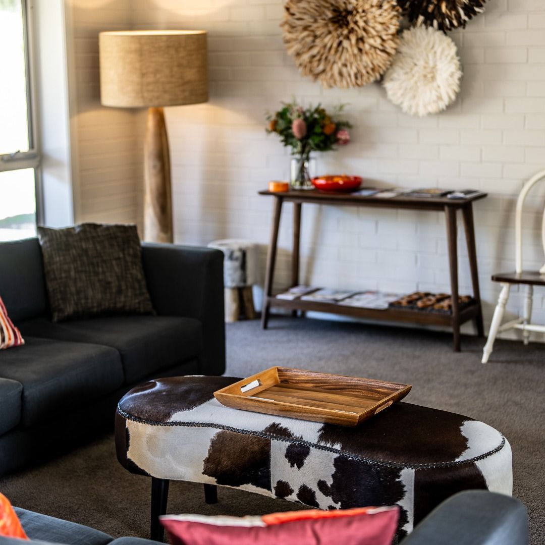 A Plate of Meat, Cheese, Olives and Tomatoes on a Table — Lakeview Luxury Retreat in Canobolas, NSW