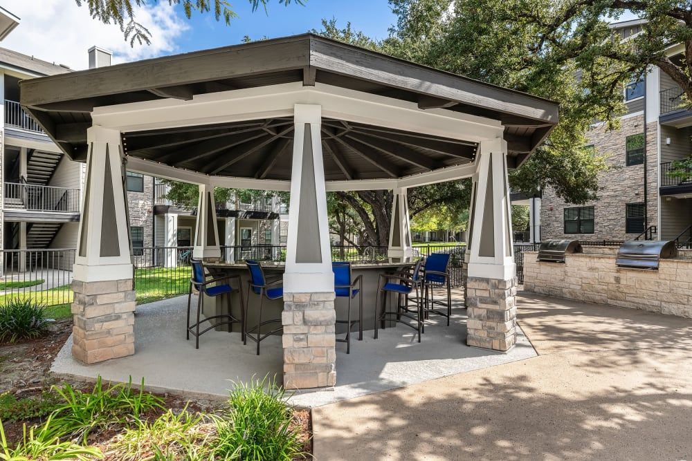 there is a gazebo with a table and chairs underneath it at Marquis on Lakeline in Cedar Park, TX.