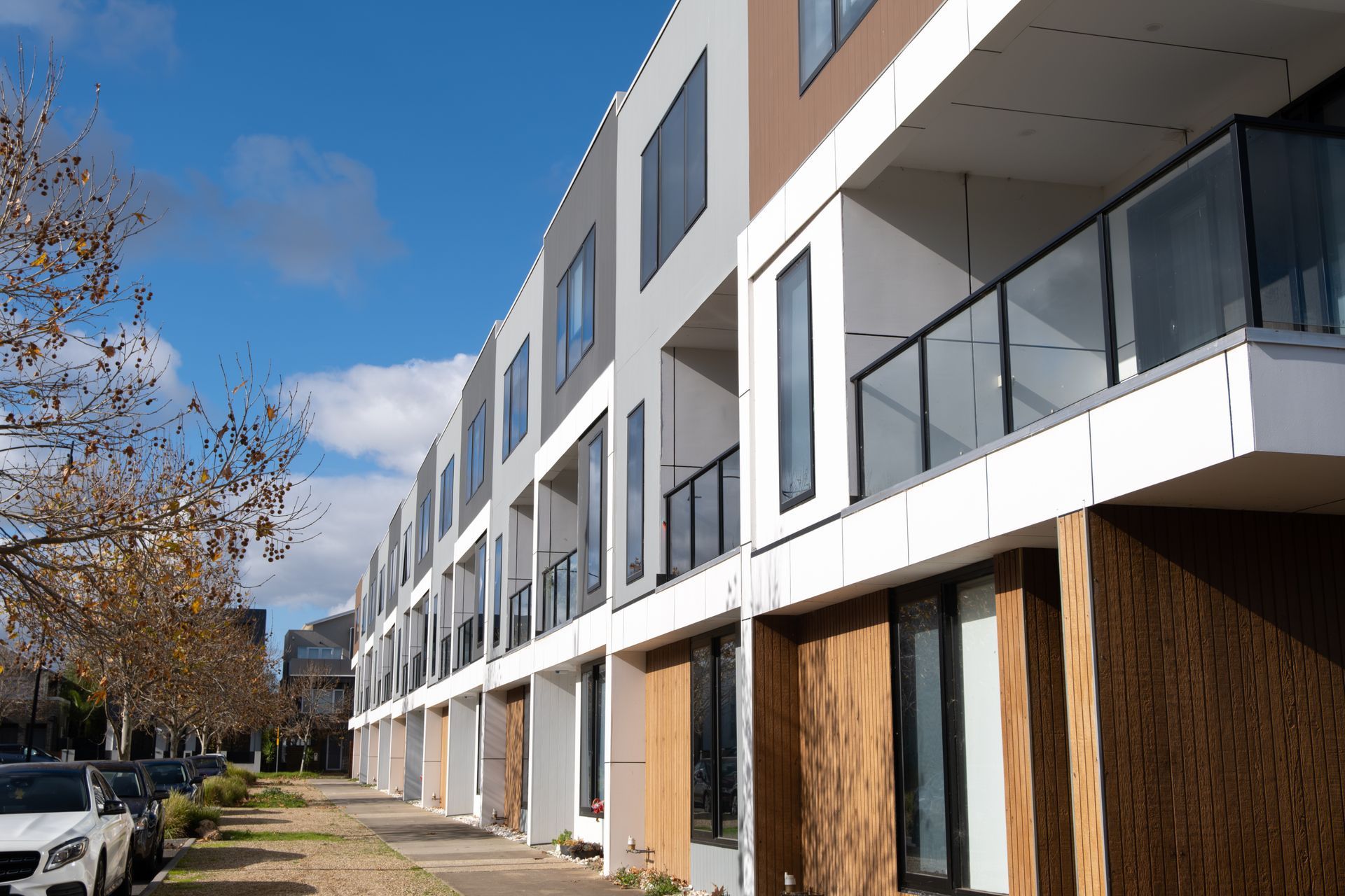 A row of brand new 3-storey residential townhouses.