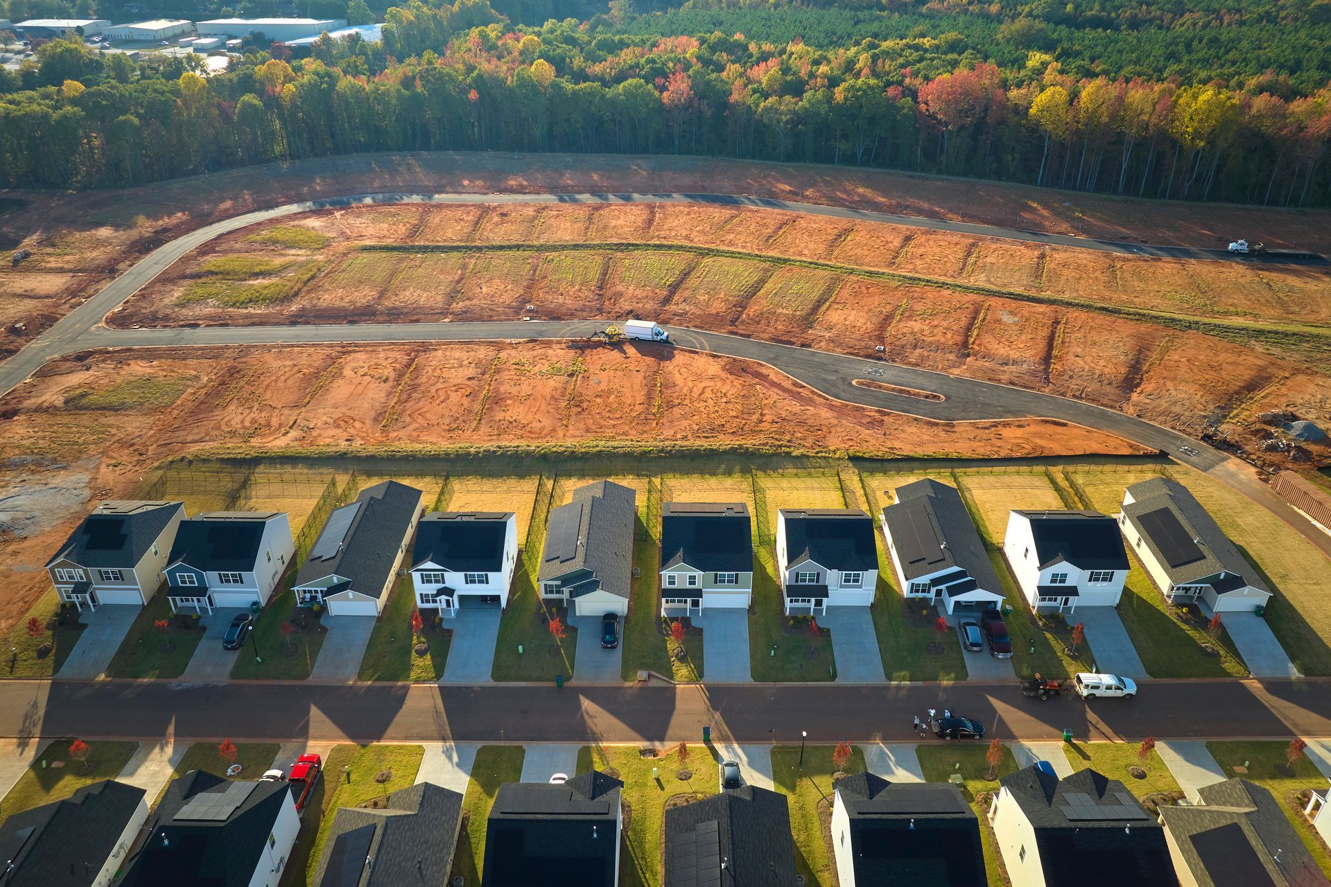Aerial view of various graded dirt lot construction sites.