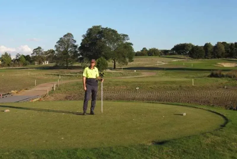 Surveyor on Golf Field — Mornington Peninsula, VIC — Carson Development Consultants Pty Ltd
