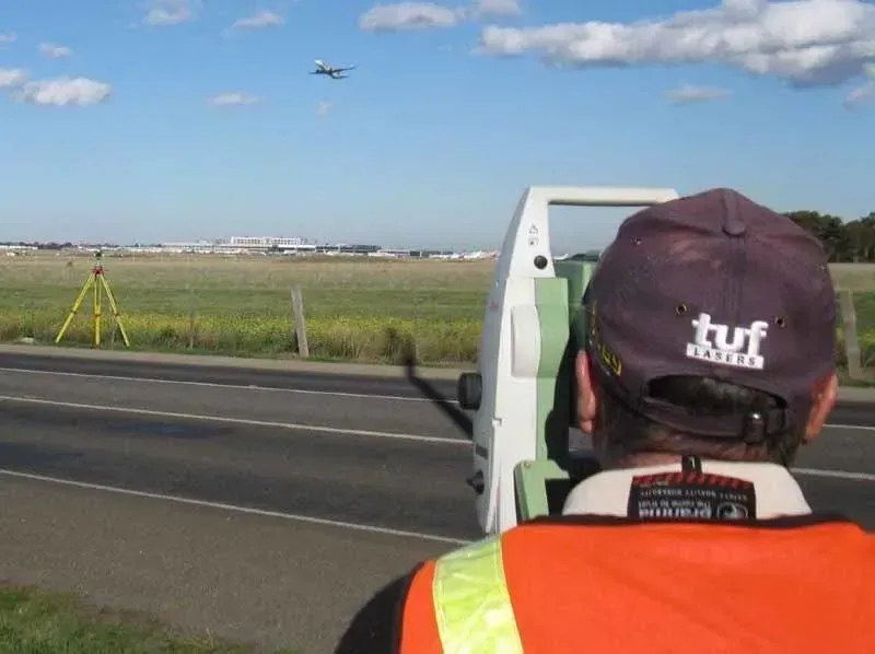 Using Surveying Tool Beside the Road — Mornington Peninsula, VIC — Carson Development Consultants Pty Ltd