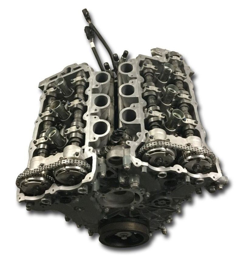 A close up of a car engine on a white background