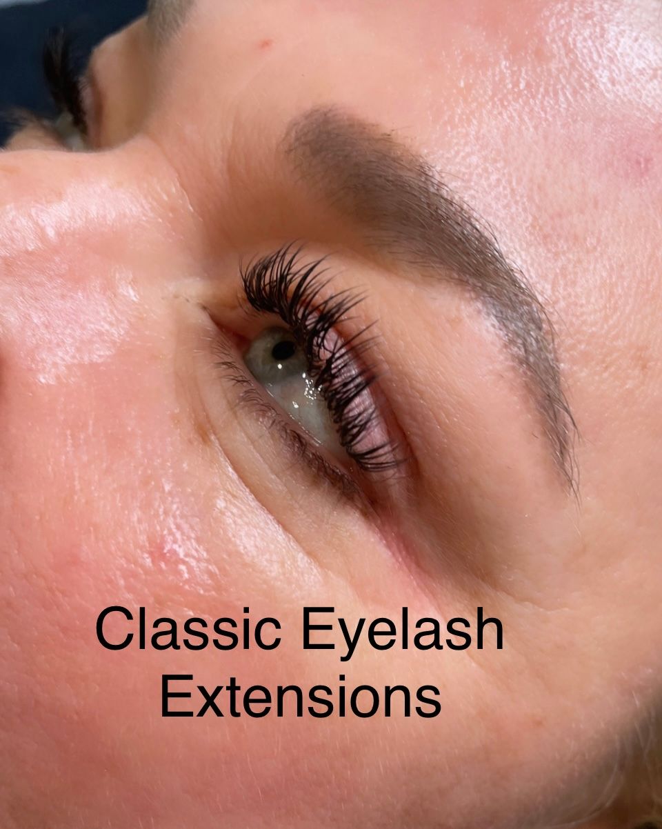 A close up of a woman 's face with classic eyelash extensions