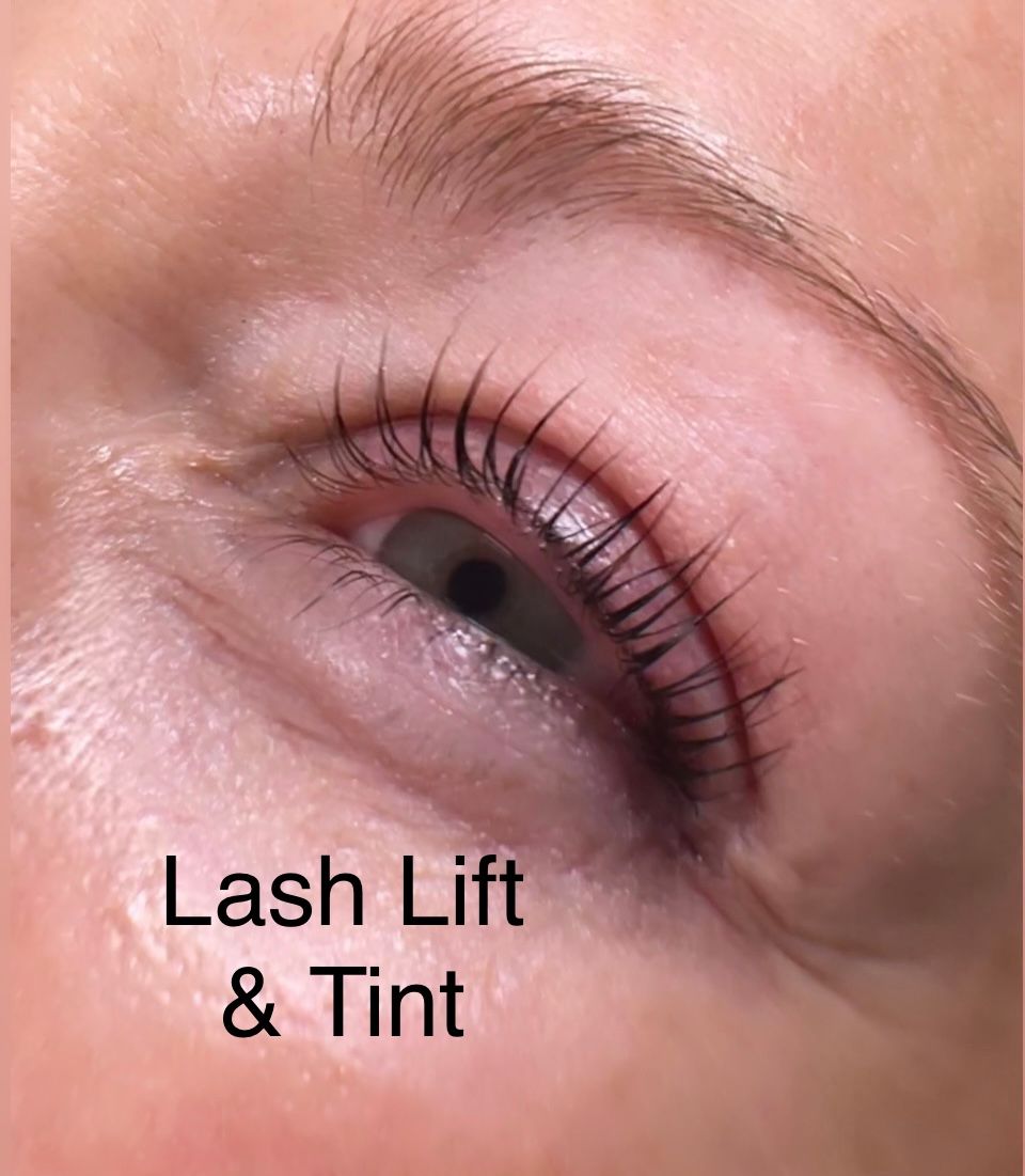 A close up of a woman 's eye with lash lift and tint.