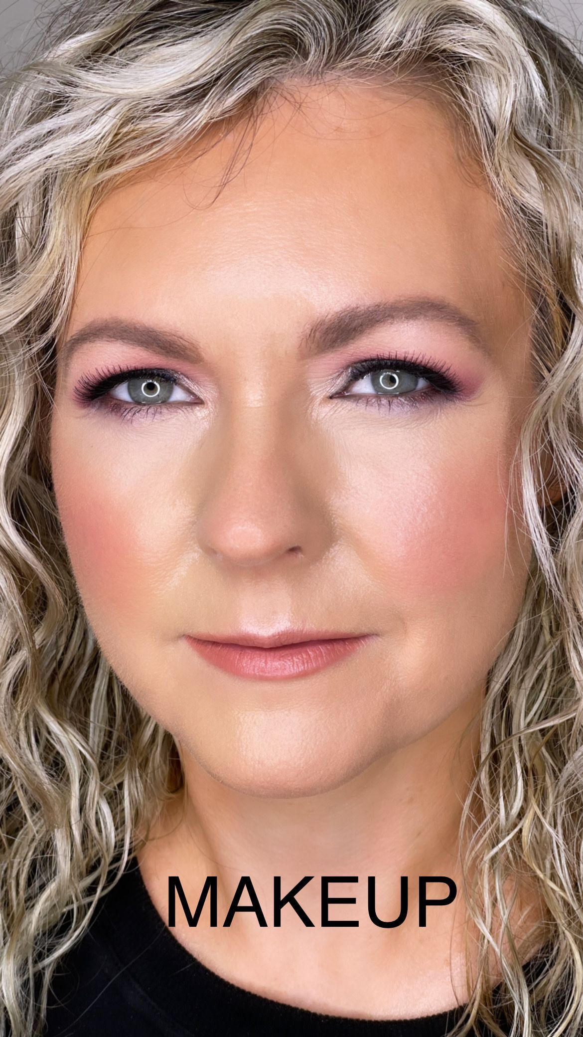 A close up of a woman 's face with makeup on.