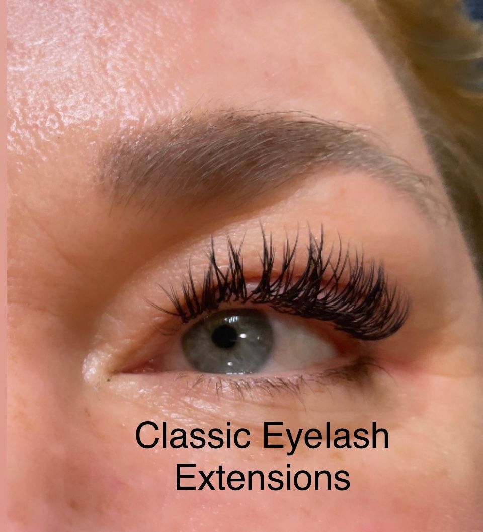 A close up of a woman 's eye with classic eyelash extensions