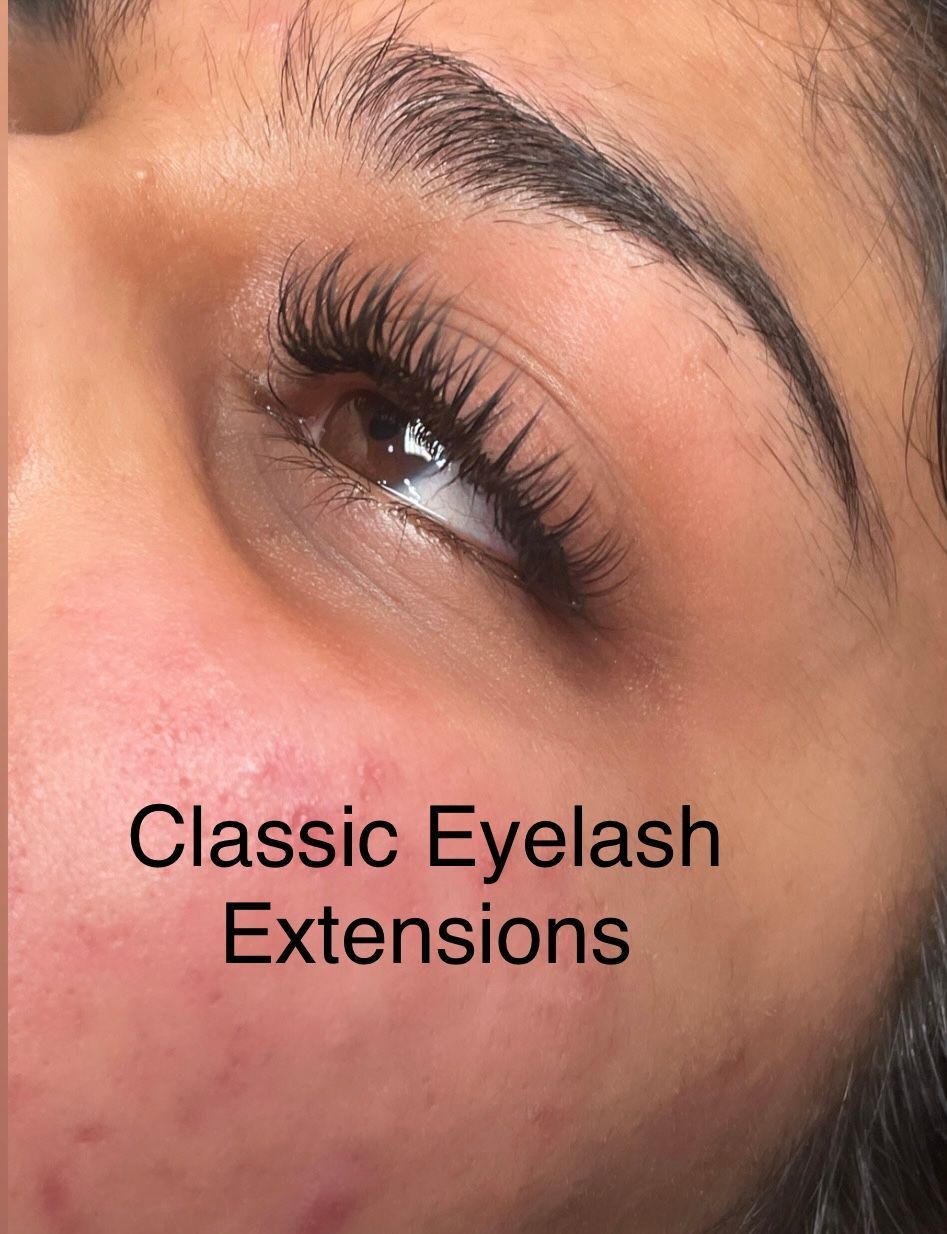 A close up of a woman 's face with classic eyelash extensions.