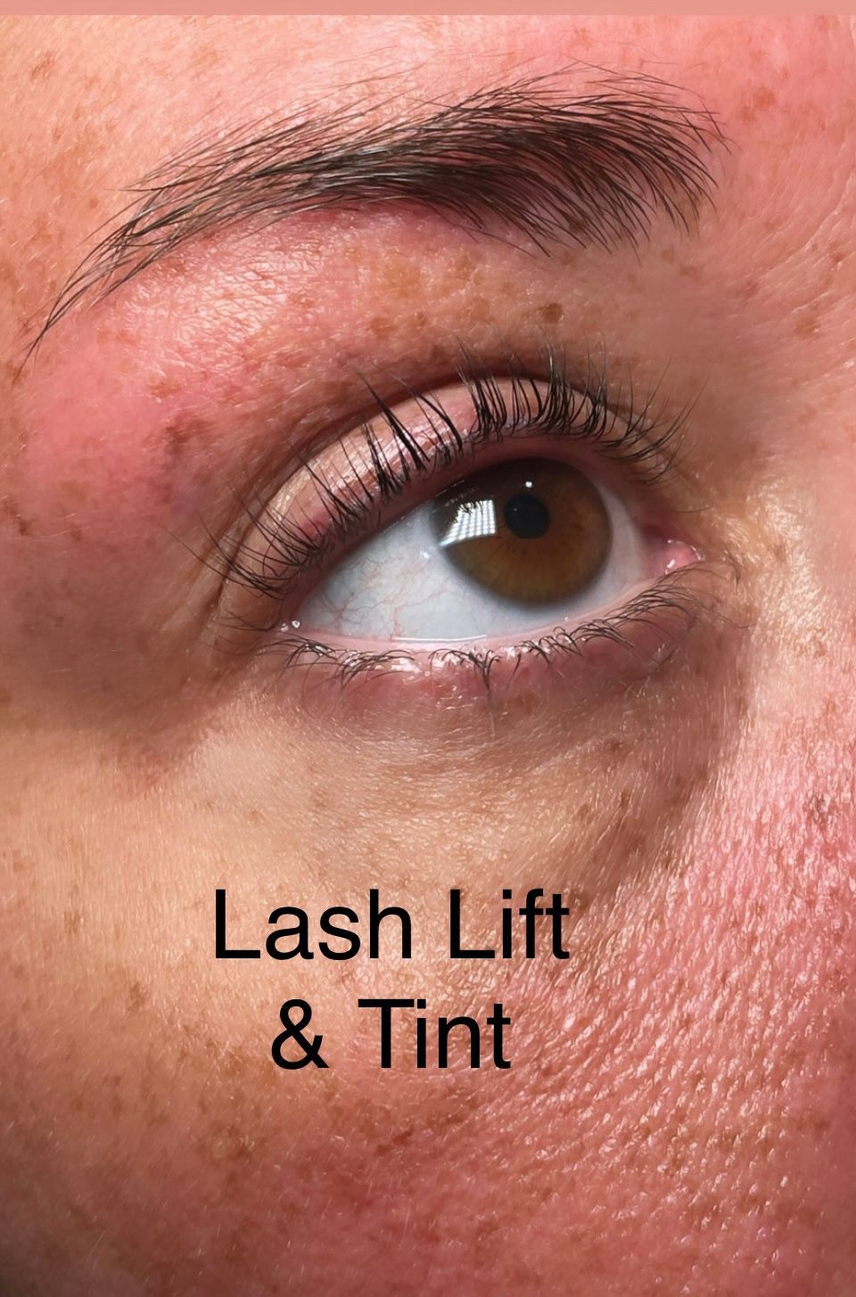 A close up of a woman 's eye with lash lift and tint.